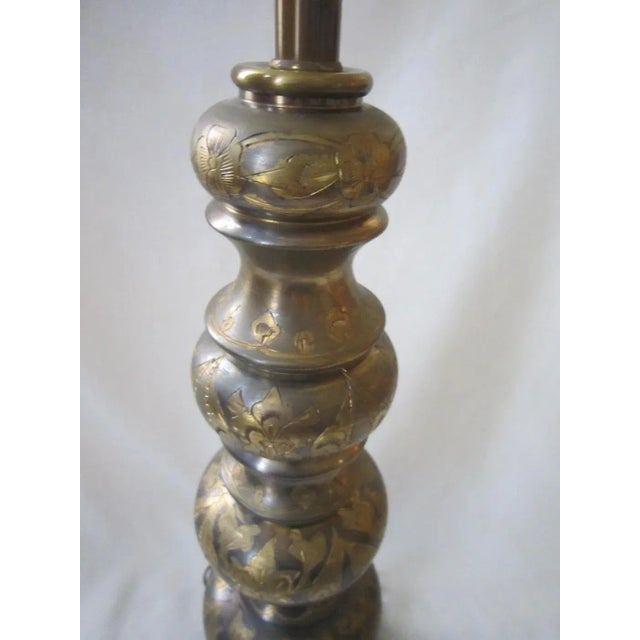 Ornate India Brass/Metal Table lamp. Mounted on a Marble base, it is wired and in good working condition. The lamp...