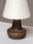 This rare table lamp was designed by gunnar nylund and produced by rörstrand in sweden during the 1960s. The base is...