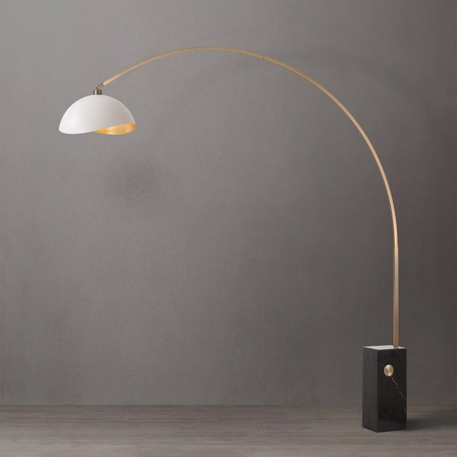 Crafted with weathered brass and a black marble base, the Iconic Arc Lamp is a Mid-Century Modern masterpiece. This lamp...