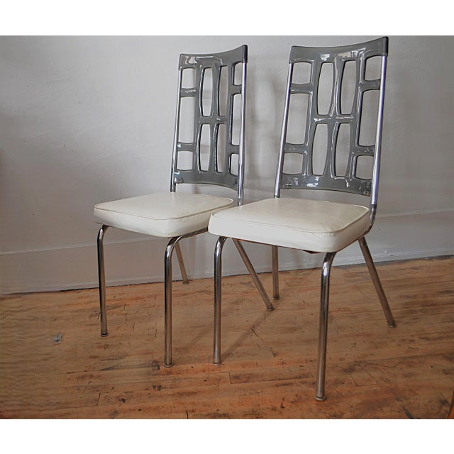 70's Stoneville Dining Chair Set. Chromed steel frame with smoked Lucite seat backs and naugahyde upholstered seats in...