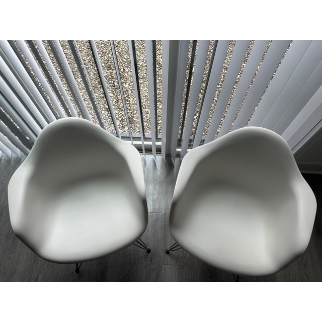 Purchased new from Design Within Reach a few years ago, these authentic Herman Miller Eames molded plastic armchairs have...