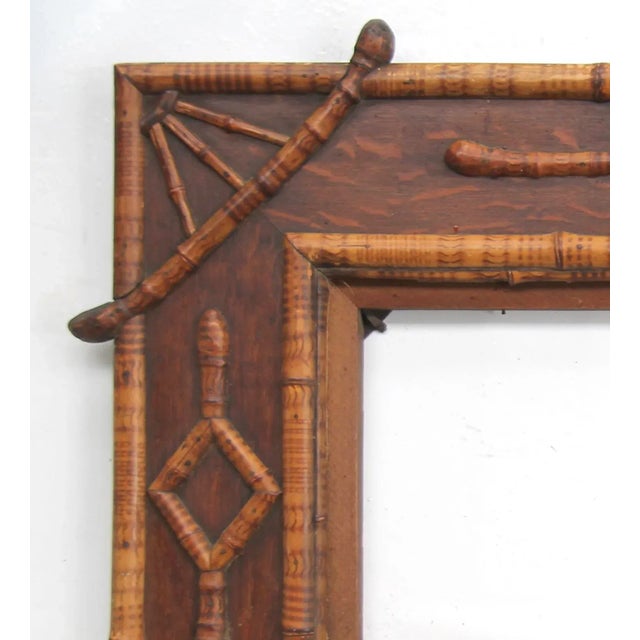 Beautiful Victorian era quarter sawn oak frame decorated with bamboo, top two diagonal bamboo pieces have the root. Frame...
