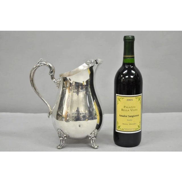 Vintage International Silver Co Silver Plated Victorian Style Bulbous Water Pitcher. Circa Mid 20th Century. Measurements:...