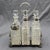 English silver plate & cut glass cruet set, circa 1880. Silver plate by Atkin Brothers, Sheffield (post 1853 marks). The...