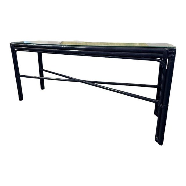 Bring timeless coastal sophistication to your home with this beautifully restored vintage faux bamboo console table....