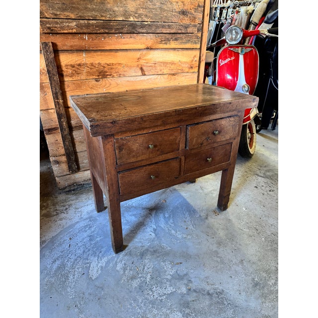 This exceptional 19th-century European provincial work table beautifully showcases the raw, tactile charm of antique...