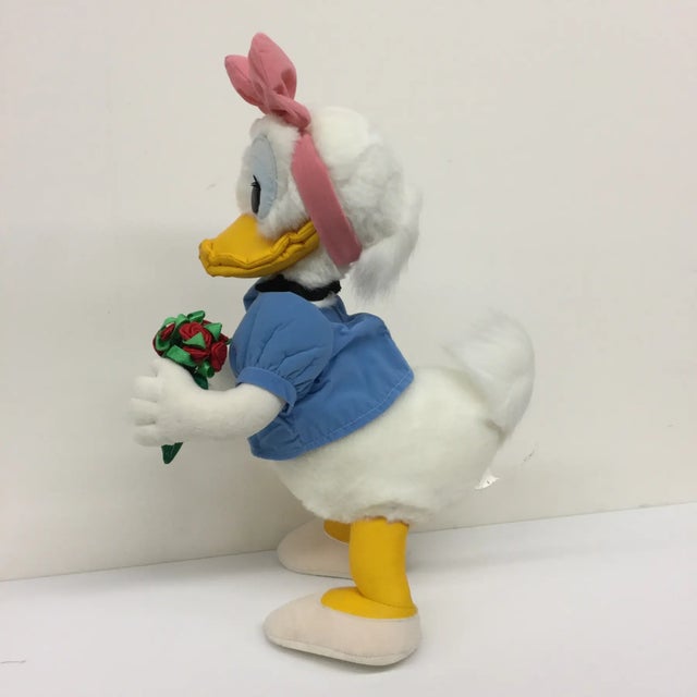 This duck was purchased from Disneyland in Japan in 1990. She has been meticulously cared for and wrapped up perfectly...