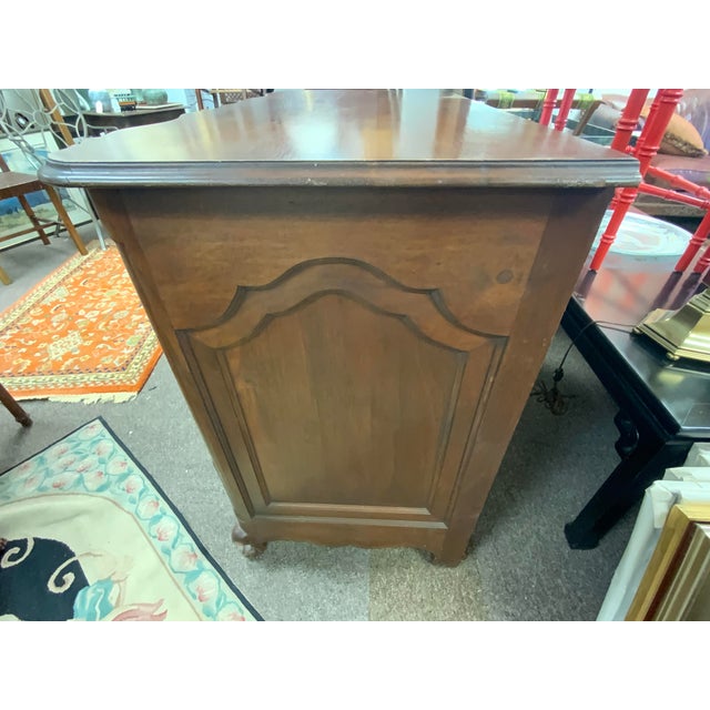 G. Fox Company, Early 20th century copy of a Louis XV antique. Walnut wood, brass hardware. Serpentine, with blocked ends....