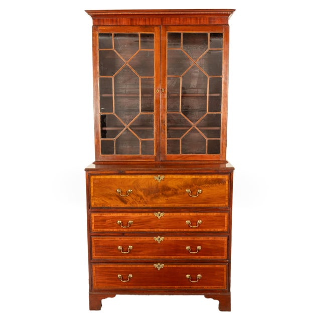 A very fine quality antique George III inlaid flame mahogany bookcase secretary, circa 1780. The bookcase bureau is in two...