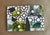 A striking geometric collage combining mossy green watercolor textures with bold graphic patterning and playful circular...
