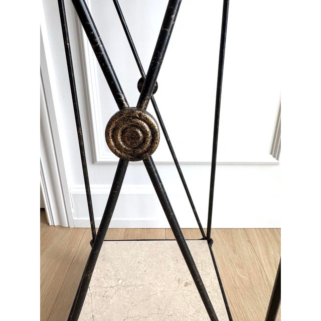 Elegant, timeless vintage iron pedestal stand, likely Italian, featuring a refined neoclassical silhouette and two thick...