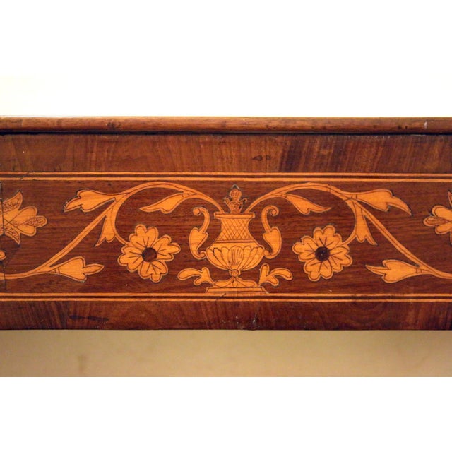 Handsome 19th century English Regency console table made of mahogany with a satinwood frieze. The intricate inlay,...
