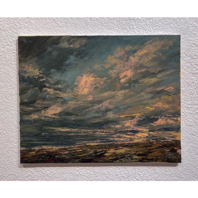 The painting captures the dramatic sky over the Eastern Plains of Colorado, where swirling clouds are infused with hues of...