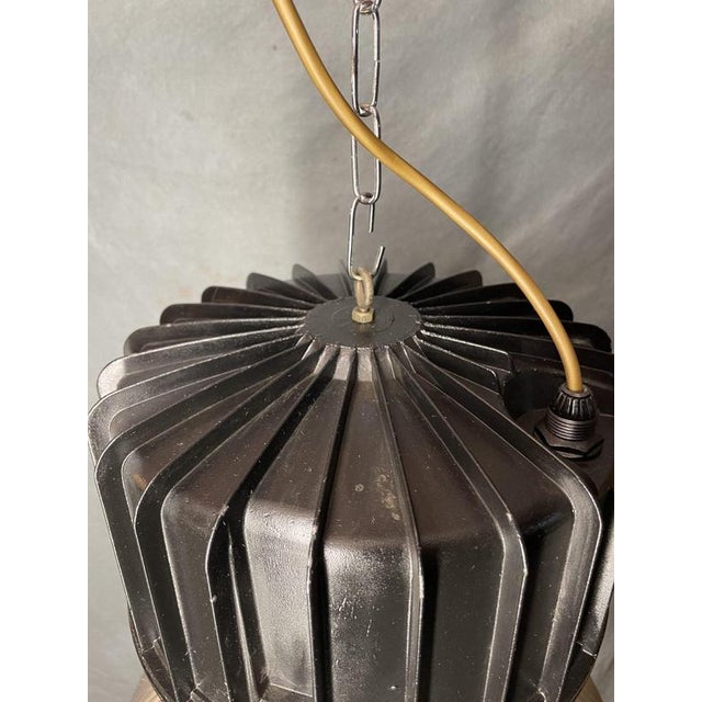 A striking vintage industrial pendant light with an aluminium ribbed shade and bakelite top section, newly rewired with a...