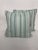 Embroidered seafoam/seamist striped pillows with shade variations of the same color. On top of the stripes are embroidered...
