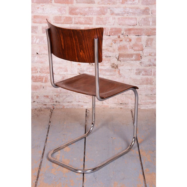 This set of four chairs is an iconic example of the Bauhaus style, originating from 1930s Czechoslovakia. The chairs...
