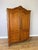 A beautifully presented Vintage French Louis wardrobe in oak, featuring two shaped panelled doors, a decorative curved top...