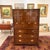 Vintage 1970s campaign-style oak gentleman's dresser featuring open shelving in the upper cupboard, four drawers, recessed...