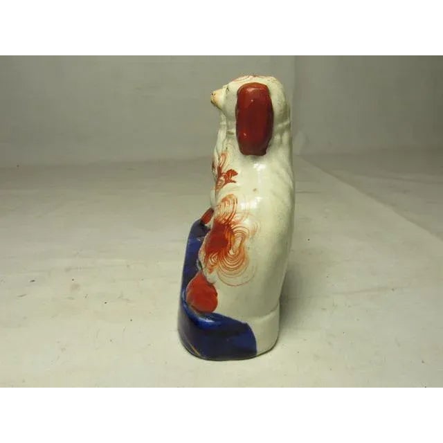 A nice grouping of a Staffordshire spaniel family, c.1880. A nice form, of two adults with a happy youngster between them....