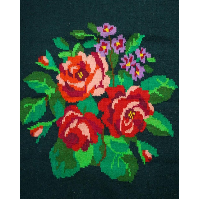 Long vintage handwoven 100% wool runner rug with dramatic rose bouquets and a floral garland border on a deep dark...