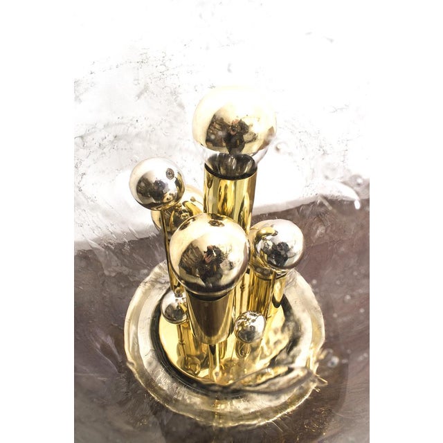 A stunning table lamp by doria! the big glass globe in combination with the playful messing and chrome parts on the inside...