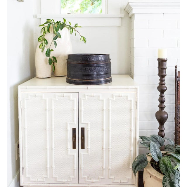 This antique, South Asian round Betel Box features a scrolling, floral embossed black lacquer pattern outside and bright...