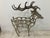 This polished cast aluminum wine rack holds 11 bottles of wine. Very unusual whimsical firm Can see this in a country...