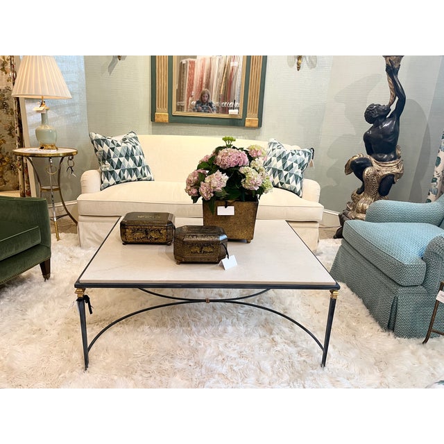 MId century styled coffee table with limestone top that sits in the frame of the base Charcoal wash sleek tapered legs...