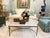MId century styled coffee table with limestone top that sits in the frame of the base Charcoal wash sleek tapered legs...
