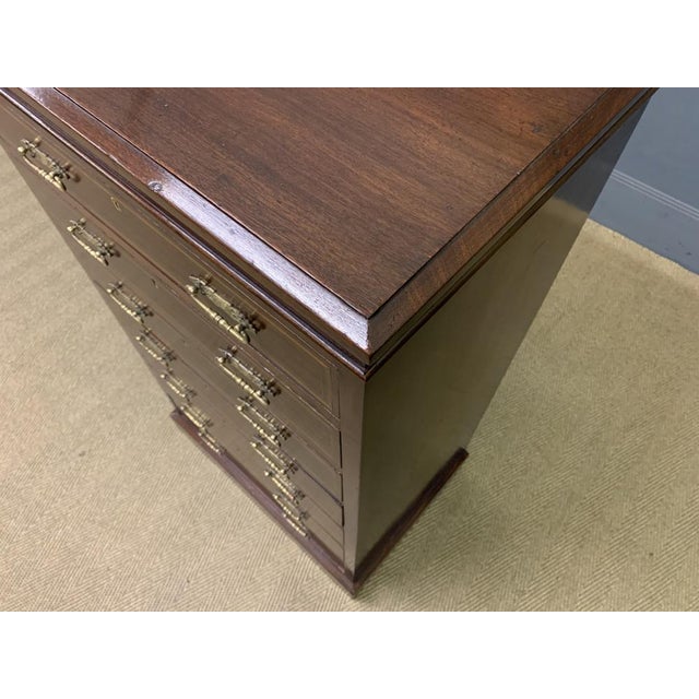 An excellent Edwardian period tall inlaid mahogany pillar chest by Maple and Co of London. with a series of 7 graduated...