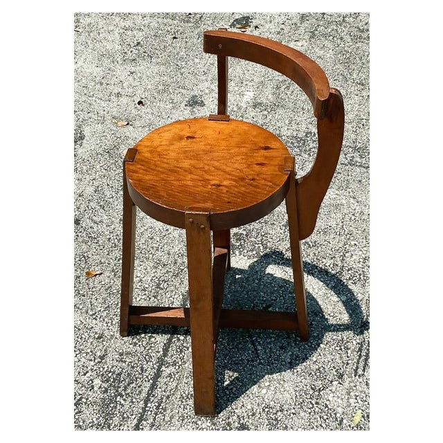 Elevate your space with this vintage boho primitive side chair. Its rustic design and natural wood finish bring a touch of...