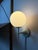 A rare collector's item of Swiss Functionalism: This wall lamp in white opal glass was designed by design icon Max Bill...