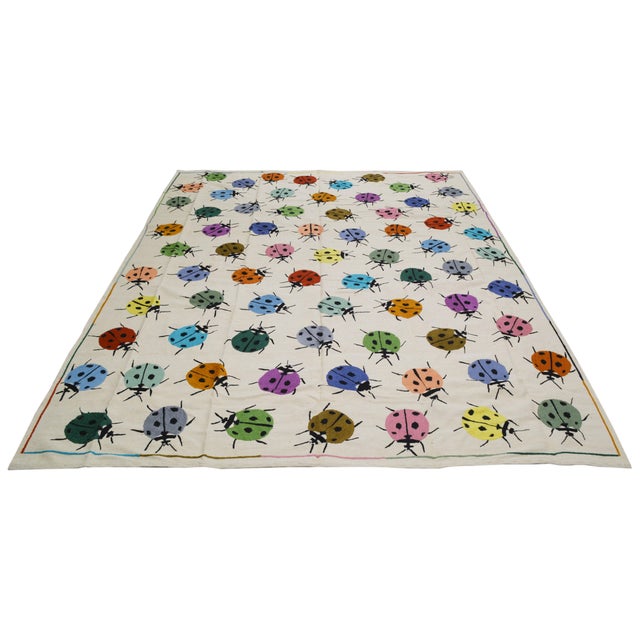 Modern Afghan Style Hand Knotted Wool Kilim Rug With Ladybug Design was made with care using traditional rug-making...