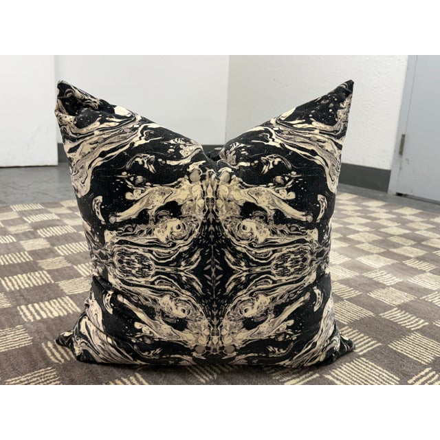 Design Plus Gallery presents a Banke Kuku Abstract Velvet Throw Pillow. The pillow showcases a mirrored marbled pattern in...