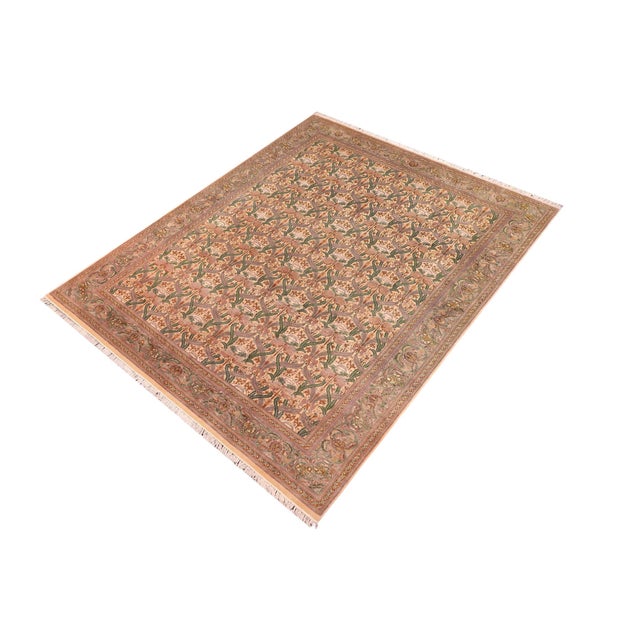 Designed with mesmerizing intricacy and gorgeous color palette, this hand-knotted masterpiece demonstrates the beauty and...