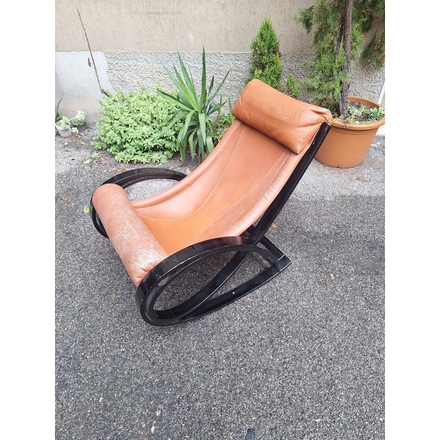 Burgundy Leather Mod. Sgarsul Rocking Chair by Gae Aulenti for Poltronova, 1970s, in Good conditions. Designed 1970 to...