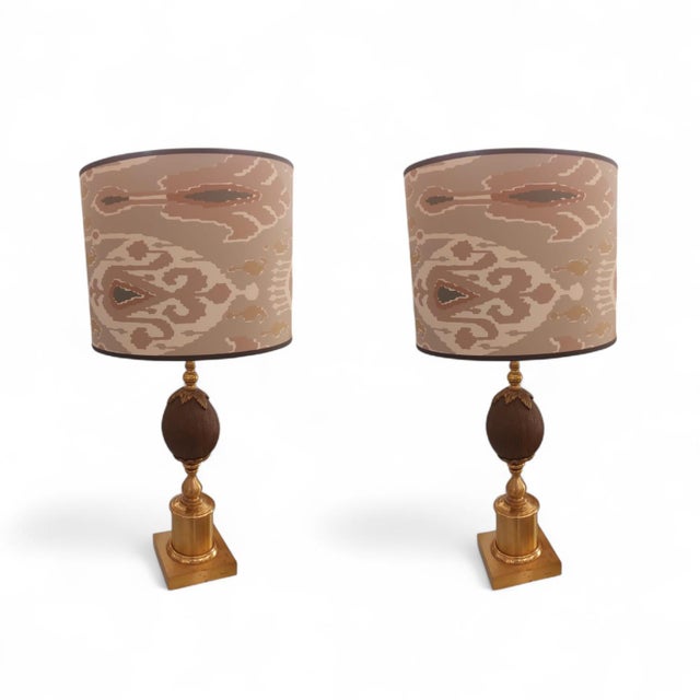 Pair of Maison Charles style lamps dating from the 50s whose body and square base are made of gilded brass framing a...