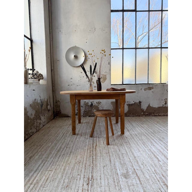 Vintage oval farmhouse table from the 1960s. we love its elongated shape, resting on four very elegant round legs. We...