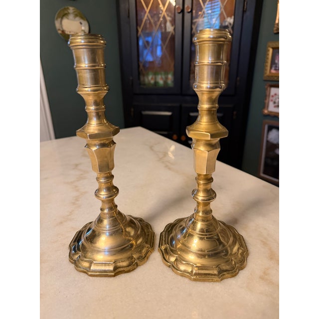 This pair of vintage solid brass taper candlesticks stands at 9.25 inches tall with a 4-inch scalloped base, perfect for...