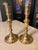 This pair of vintage solid brass taper candlesticks stands at 9.25 inches tall with a 4-inch scalloped base, perfect for...
