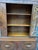 An exquisite, highly stylized American Art Deco waterfall china cabinet dating from the late 1930s to early 1940s. The...