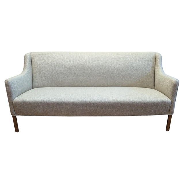 Ole Wanscher Sofa for A. J. Iversen newly upholstered in Kravet tight Boucle. A sofa with a raised, tight back and sloping...