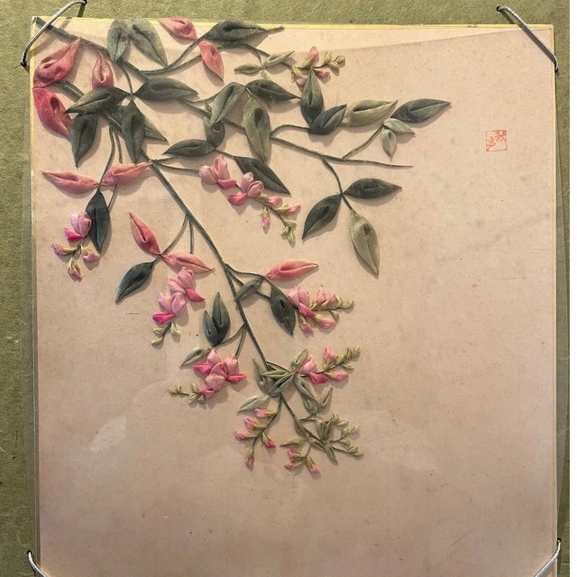 This exquisite vintage Japanese silk ribbon embroidery features a vibrant, three-dimensional floral arrangement in the...