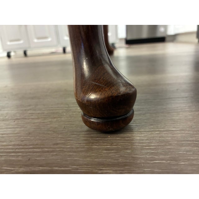 Queen Anne style in excellent condition with average wear on the surface. Easily expandable with two 16-inch leaves....