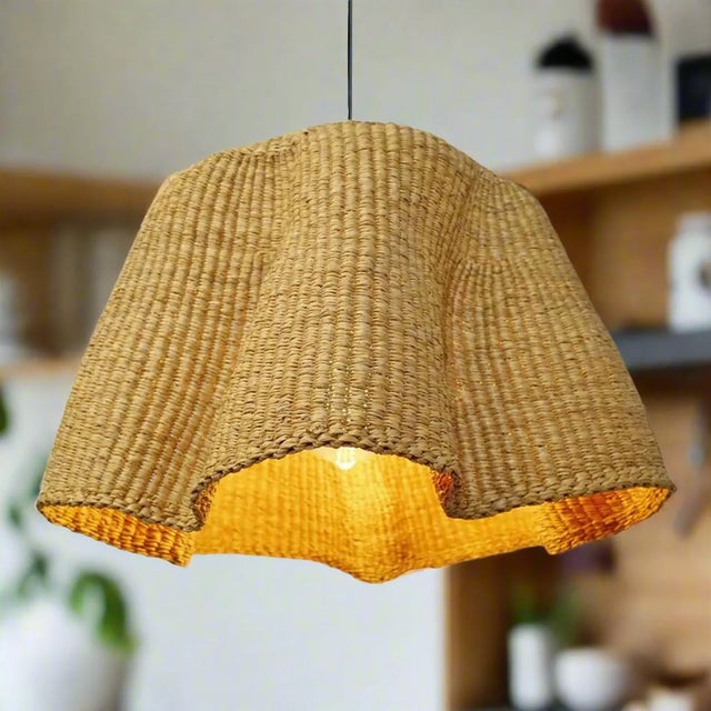 Elevate your home décor with the authentic Bolga Lampshade, handwoven in Bolgatanga, Ghana. Crafted from durable elephant...