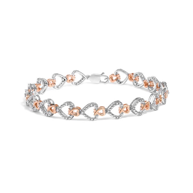 Embrace elegance and eternal beauty with this stunning bracelet, masterfully crafted using 10K rose and white gold. The...