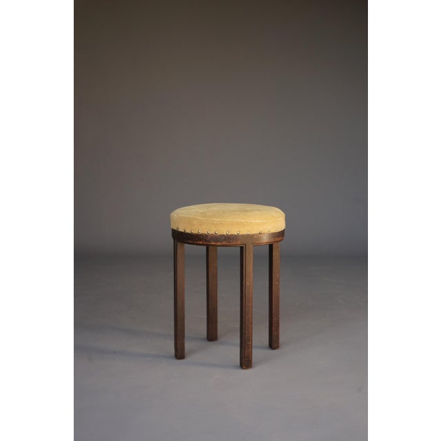 A rare stool in totally all original condition. It has a makers label and is stamped with the makers name alongside a...