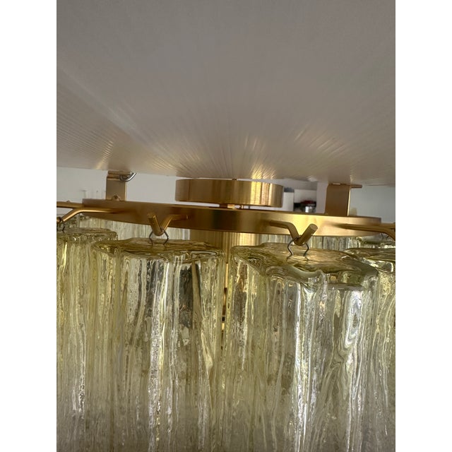 Scenographic italian hand-made flush mount with clear amber “tronchi” , elements of Murano glass. Elegant Flush mount in a...