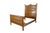 A stately antique golden oak high-back late 19th-century American bed. Showcasing a warm honey finish that highlights the...