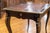 Ebonized wood writing desk with leather top, single drawer and brass appliques. Circa: 1870